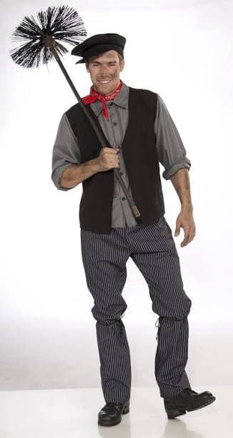 Smiling man in chimney sweep costume holding a brush with soot on his face.